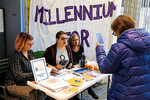 Daniel Crump / Winnipeg Free Press.¤Members of the Millennium For All group hand out information by their table in front of the Millennium Library Saturday afternoon. (From left) Brianne Selman, Marika Prokosh, and Sarah Broad. February 22, 2020.