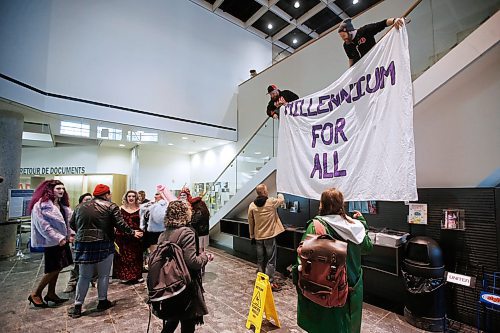 JOHN WOODS / WINNIPEG FREE PRESS
A sign is hung as drag queens and kings prepare to read story books to children in the lobby of the Millennium Library in Winnipeg Sunday, February 23, 2020. 

Reporter: Standup