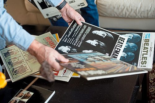 Mike Sudoma / Winnipeg Free Press
Michael Gillespie reaches for a couple of records out of his collection as he and friend Dan Donahue spend an afternoon taking a look at the collection of records Friday
February 21, 2020