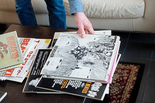 Mike Sudoma / Winnipeg Free Press
Dan Donahue picks up a copy of The Beatles Revolver album as he and friend Michael Gillespie talk Beatles Friday afternoon
February 21, 2020