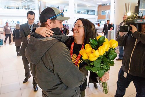 MIKE DEAL / WINNIPEG FREE PRESS
Team Manitoba skip Kerri Einarson kisses her husband, Kyle, after arriving at the Winnipeg James Armstrong International Airport Monday morning following her teams big win at the Scotties Tournament of Hearts in Moose Jaw, Sask. on Sunday.
200224 - Monday, February 24, 2020.