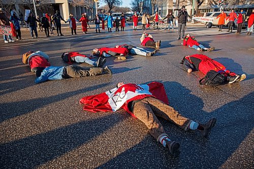 MIKE DEAL / WINNIPEG FREE PRESS
Members and supporters of the Manitoba Energy Justice Coalition in solidarity with the Tyendinaga Mohawk in Ontario who were arrested today and the Wetsuweten in British Columbia, join Indigenous youth for a die-in and round dance at Portage Avenue and Dominion Street in front of the RCMP 'D' division headquarters, during rush hour on Monday. 
200224 - Monday, February 24, 2020.