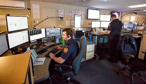 MIKE DEAL / WINNIPEG FREE PRESS
Senior Communication operators Ryan (left) and Jared (right) taking calls at their stations in the WFPS callcentre.
200221 - Friday, February 21, 2020.