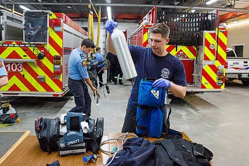 MIKE DEAL / WINNIPEG FREE PRESS
Firefighter Jaden Friesen cleans and repack gear after getting back to Station One from a callout Friday evening.
200221 - Friday, February 21, 2020.