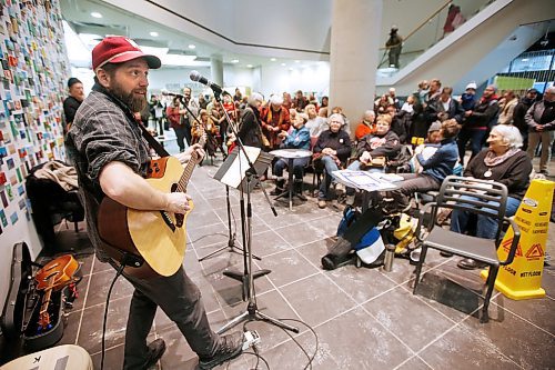 JOHN WOODS / WINNIPEG FREE PRESS
John Samson sings his song Millennium For All at a Millennium For All rally at the Millennium Library in Winnipeg Tuesday, February 25, 2020. The group was formed a year ago to protest security measures at the entrance of the library.

Reporter: ?