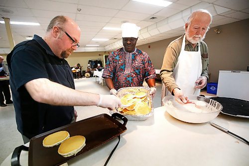 JOHN WOODS / WINNIPEG FREE PRESS
Michael Penner, left to right, Joshua Odufuwa and Alfred Wiebe serve up pancakes at the Shrove Tuesday meal at St Johns Anglican Cathedral in Winnipeg Tuesday, February 25, 2020. Today is Shrove Tuesday or Pancake Tuesday, the day before Lent on the Christian calendar. Lent is the six week period before Easter which is sort of somber, reflective time. Several congregations are having community pancake suppers today. Pancakes were traditionally eaten on the day before Ash Wednesday because they were a way to use up eggs, milk, and sugar before the fasting season of the 40 days of Lent.

Reporter: Standup