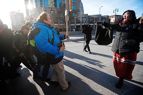 JOHN WOODS / WINNIPEG FREE PRESS
A person speaking out against protesters in support of Wetsuweten blockades who closed Portage and Main to traffic in Winnipeg Wednesday, February 26, 2020 is removed by police after getting surrounded by protesters. 

Reporter: ?