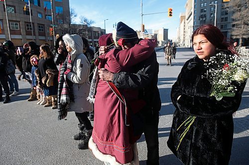 JOHN WOODS / WINNIPEG FREE PRESS
A woman gives a hug to a homeless man who spoke to protesters in support of Wetsuweten blockades who closed Portage and Main to traffic in Winnipeg Wednesday, February 26, 2020. 

Reporter: ?