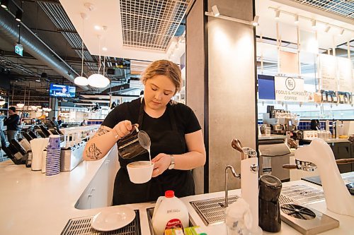 Mike Sudoma / Winnipeg Free Press
Steph Derksen finishes a customers Hot Chocolate with some latte art at Fools and Horses new location inside of Hargrave Market Thursday afternoon
February 27, 2020