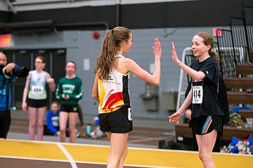 MIKAELA MACKENZIE / WINNIPEG FREE PRESS

Emilee Rieger, 13 (left), high-fives Brigitte Saw, 12, after the 1200m U14 final race at the 39th Annual Boeing Classic Indoor Track & Field Championships at the Max Bell Centre in Winnipeg on Friday, Feb. 28, 2020. Standup.
Winnipeg Free Press 2019.