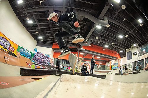 Mike Sudoma / Winnipeg Free Press
Nick Drummond flips a backside flip over a picnic table at the Edge Indoor Skatepark Friday evening
February 28, 2020