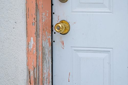 Daniel Crump / Winnipeg Free Press. Blood smears on the door of unit 54 at the Capri Motel on Pembina hwy at the site where several people were seriously attacked by dogs. February 29, 2020.