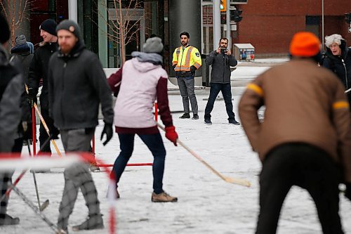 JOHN WOODS / WINNIPEG FREE PRESS
Security records members of Millennium For All as they play street hockey in True North Square in Winnipeg Sunday, March 1, 2020. The group organized the game to protest lack of access to public space and city budget cuts. The group was asked to leave the space by security.
Reporter: Waldman