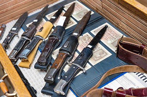 Daniel Crump / Winnipeg Free Press.¤A collection of knifes, reichsmarks, and other Nazi memorabilia up for auction at McSherrys Auction House in Stonewall on Saturday. February 29, 2020.