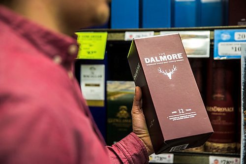 MIKAELA MACKENZIE / WINNIPEG FREE PRESS

Aaron Albas picks up a showstopper whiskey at the Grant Park Liquor Mart in Winnipeg on Monday, March 2, 2020. For Ben Sigurdson story.
Winnipeg Free Press 2019.