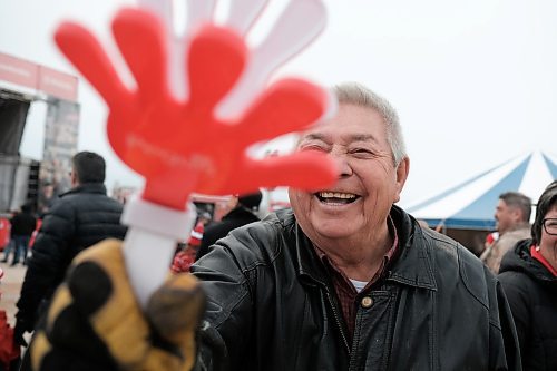 Mike Sudoma / Winnipeg Free Press
Lawrence Sutherland, a hockey fan and a hockey coach back in the early 1980s at Peguis First Nation, smiles as he  plays with a Peguis branded noise maker as he watches the main stage during the Hometown Hockey event at Peguis First Nation Saturday afternoon
February 29, 2020