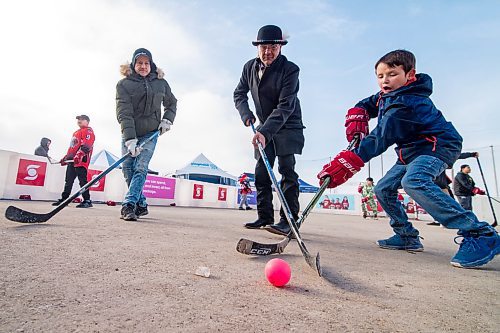Mike Sudoma / Winnipeg Free Press
Clarence Irons (left) and Earl Wood (centre) play hockey with a kids from Peguis first nation during Saturdays Hometown Hockey event 
February 29, 2020