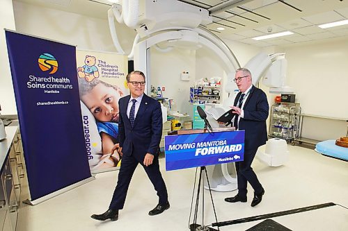 MIKE DEAL / WINNIPEG FREE PRESS
Health, Seniors and Active Living Minister Cameron Friesen and Ronan Segrave, Chief Operating Officer (right) during the official opening of the new paediatric catheterization lab at HSC Winnipeg Childrens Hospital Tuesday afternoon.
200303 - Tuesday, March 03, 2020.