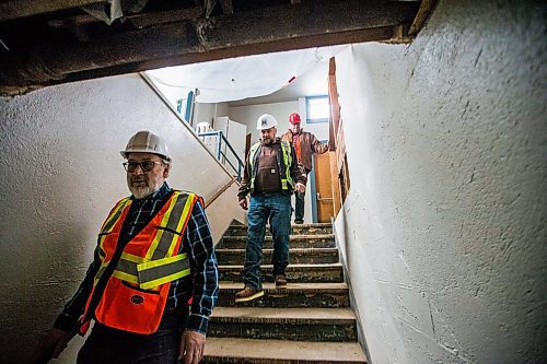 MIKAELA MACKENZIE / WINNIPEG FREE PRESS

Giovanni Geremia, principal of GW Architecture Inc. (left), Jan Woycheshen, project superintendent of M Builds, and Glenn Michalchuk, president of the Association of United Ukrainian Canadians, go down the stairs to the basement at the Ukrainian Labour Temple, which is undergoing renovations to make it accessible, in Winnipeg on Wednesday, March 4, 2020. For Sol Israel story.
Winnipeg Free Press 2019.