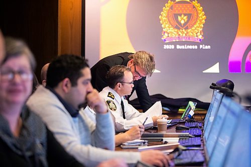MIKAELA MACKENZIE / WINNIPEG FREE PRESS
Police chief Danny Smyth (left) and chairperson of the board Kevin Klein consult before the Police Board meeting at City Hall in Winnipeg on Friday, March 6, 2020. For Danielle Da Silva story.
Winnipeg Free Press 2019.