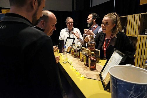 Daniel Crump / Winnipeg Free Press. Nastasia Perrin, a representativ for Crown Royal, explain their product to visitors of the Winnipeg Whisky Festival at the Fairmont Winnipeg. March 6, 2020.