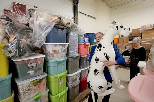 SHANNON VANRAES / WINNIPEG FREE PRESS
Hedy McClelland carries a plush Great Dane through a West End warehouse on March 6, 2020. McClelland uses the warehouse to store her massive collection of dolls and other collectables.