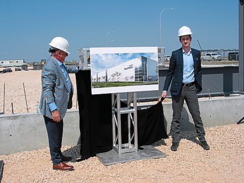 Canstar Community News May 29, 2019 - On May 29, (from left) Groupe Touchette founder Andre Touchette and Touchette's director of real estate Kevin Lutfy unveiled a drawing of the new tire distribution centre that is being constructed in CentrePort Canada's Brookside Industrial Park Phase III in the RM of Rosser.(ANDREA GEARY/CANSTAR COMMUNITY NEWS)