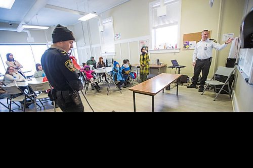 MIKAELA MACKENZIE / WINNIPEG FREE PRESS

Austin Olek, animal resources officer, and dog Gemma visit the NEEDS class to introduce dogs and pet ownership to the newcomers in Winnipeg on Monday, March 9, 2020. For Eva Wasney story.
Winnipeg Free Press 2019.