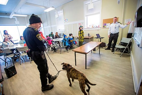 MIKAELA MACKENZIE / WINNIPEG FREE PRESS

Austin Olek, animal resources officer, and dog Gemma visit the NEEDS class as Leland Gordon, CEO of Winnipeg Animal Services, teaches the class to introduce dogs and pet ownership to the newcomers in Winnipeg on Monday, March 9, 2020. For Eva Wasney story.
Winnipeg Free Press 2019.