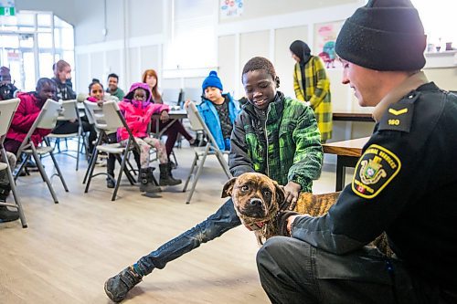 MIKAELA MACKENZIE / WINNIPEG FREE PRESS

Bhan, 10, pets Gemma in the NEEDS class introducing dogs and pet ownership to newcomers in Winnipeg on Monday, March 9, 2020. For Eva Wasney story.
Winnipeg Free Press 2019.