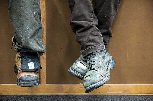 MIKAELA MACKENZIE / WINNIPEG FREE PRESS

Apprentice carpenter Jaycek Valentine's worn work boots at Fort Richmond Collegiate in Winnipeg on Tuesday, March 10, 2020. For Larry Kusch story.
Winnipeg Free Press 2019.