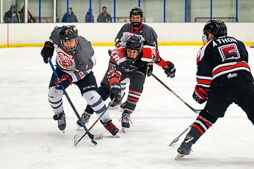 Daniel Crump / Winnipeg Free Press.¤Glenlawns Brennan Pilloud (7) carries the puck up the ice as the Lions take on the College Beliveau Barracudas in game two of the A Division High School Hockey Championships. March 10, 2020.