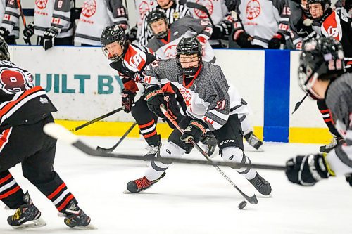 Daniel Crump / Winnipeg Free Press.¤Glenlawns Connor Davis (11) carries the puck up the ice as the Lions take on the College Beliveau Barracudas in game two of the A Division High School Hockey Championships. March 10, 2020.