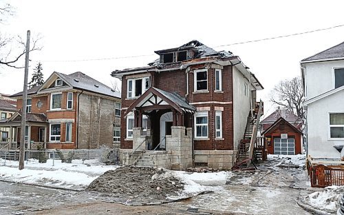 MIKE DEAL / WINNIPEG FREE PRESS
The remains of a large three story multi-unit house at 377 Burrows Ave. which was destroyed by fire shortly ?after 8 p.m. Tuesday. ?
200311 - Wednesday , March 11, 2020