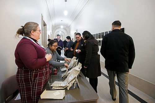 MIKAELA MACKENZIE / WINNIPEG FREE PRESS
Stake holders pick up their cellphones after being released from the budget lockup after the NDP delayed proceedings in the chamber at the Manitoba Legislative Building in Winnipeg on Wednesday, March 11, 2020. 
Winnipeg Free Press 2019.