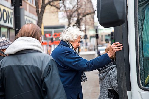 MIKAELA MACKENZIE / WINNIPEG FREE PRESS

Transit rider Susan Burns gets on to the bus in close proximity to other riders on Portage Avenue in downtown Winnipeg on Thursday, March 12, 2020. For Julia-Simone Rutgers story.
Winnipeg Free Press 2019.