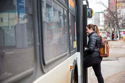 MIKAELA MACKENZIE / WINNIPEG FREE PRESS

Transit rider Mackenzie Gray gets onto the bus on Portage Avenue in downtown Winnipeg on Thursday, March 12, 2020. For Julia-Simone Rutgers story.
Winnipeg Free Press 2019.