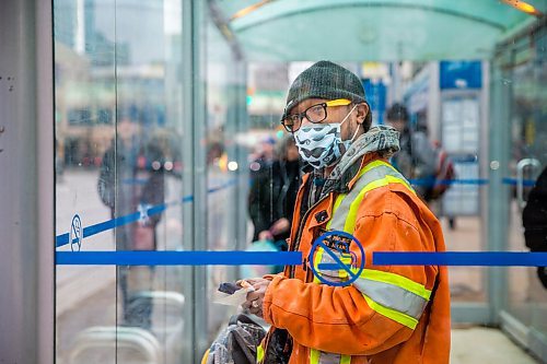 MIKAELA MACKENZIE / WINNIPEG FREE PRESS

Transit rider Jerson Salas waits for his bus on Portage Avenue in downtown Winnipeg on Thursday, March 12, 2020. For Julia-Simone Rutgers story.
Winnipeg Free Press 2019.