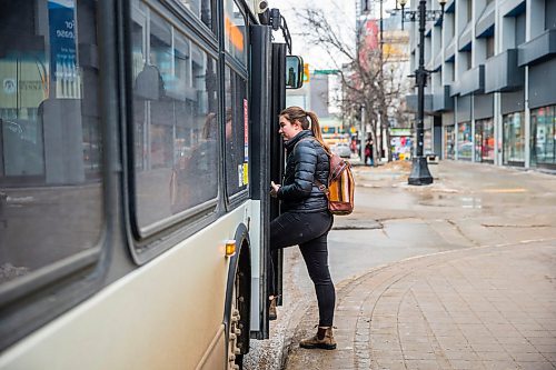 MIKAELA MACKENZIE / WINNIPEG FREE PRESS

Transit rider Mackenzie Gray gets onto the bus on Portage Avenue in downtown Winnipeg on Thursday, March 12, 2020. For Julia-Simone Rutgers story.
Winnipeg Free Press 2019.