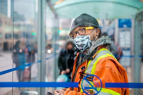 MIKAELA MACKENZIE / WINNIPEG FREE PRESS

Transit rider Jerson Salas waits for his bus on Portage Avenue in downtown Winnipeg on Thursday, March 12, 2020. For Julia-Simone Rutgers story.
Winnipeg Free Press 2019.