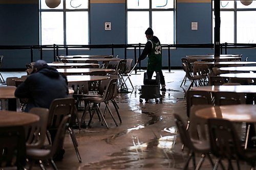 JOHN WOODS / WINNIPEG FREE PRESS
Kristine Sigua, a staff member at Siloam Mission, is photographed mopping the floor after lunch in the dining room of their shelter on Stanley in Winnipeg Thursday, March 12, 2020. 

Reporter: Abas