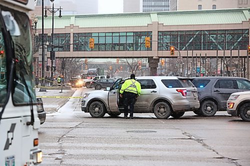 MIKE DEAL / WINNIPEG FREE PRESS

A west bound transit bus hit a pedestrian at Portage Avenue and Colony Street early Friday morning. The accident has closed down traffic heading west on Portage Ave. 
200313 - Friday, March 13, 2020