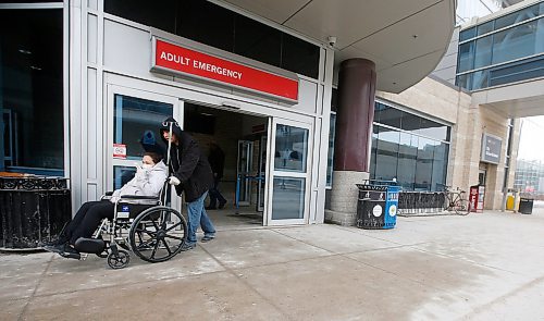 JOHN WOODS / WINNIPEG FREE PRESS
A person in a mask leaves the emergency department at Health Sciences Centre in Winnipeg Sunday, March 15, 2020. The province announced the 7th COVID-19 case.

Reporter: Allen