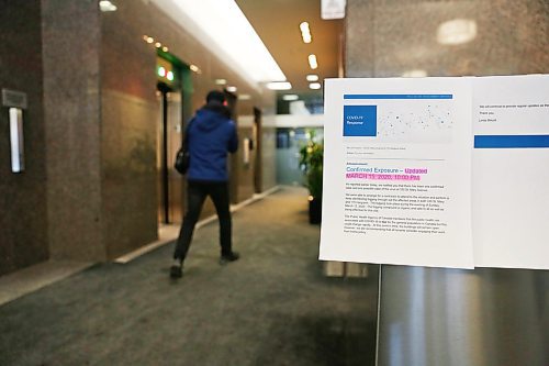 MIKE DEAL / WINNIPEG FREE PRESS

A sign by the security desk at 330 St. Mary Avenue notifies people that the owners have fogged the building with disinfectant Sunday evening after it was confirmed a person who works there tested positive with COVID-19. 
200316 - Monday, March 16, 2020