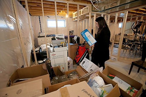 SHANNON VANRAES / WINNIPEG FREE PRESS
Kendra Turl's basement is full of wedding social prizes that may never be won. She is considering postponing her wedding social, as well as her wedding, amid widening efforts to curb the spread of COVID-19. She is pictured at her home in New Transcona on March 16, 2020.