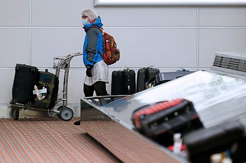 JOHN WOODS / WINNIPEG FREE PRESS
A person looks for luggage at the international airport in Winnipeg Monday, March 16, 2020. 

Reporter: ?