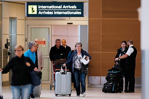 JOHN WOODS / WINNIPEG FREE PRESS
Passengers arriving from Mexico were screened, given information sheets, and asked to self isolate at the international airport in Winnipeg Monday, March 16, 2020. 

Reporter: ?