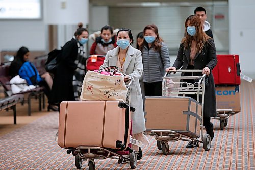 JOHN WOODS / WINNIPEG FREE PRESS
People leave the baggage area at the international airport in Winnipeg Monday, March 16, 2020. 

Reporter: ?