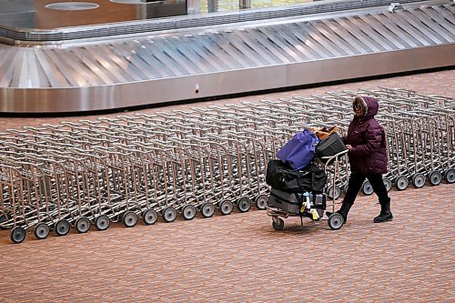 JOHN WOODS / WINNIPEG FREE PRESS
A person walks in an empty baggage area at the international airport in Winnipeg Monday, March 16, 2020. 

Reporter: ?