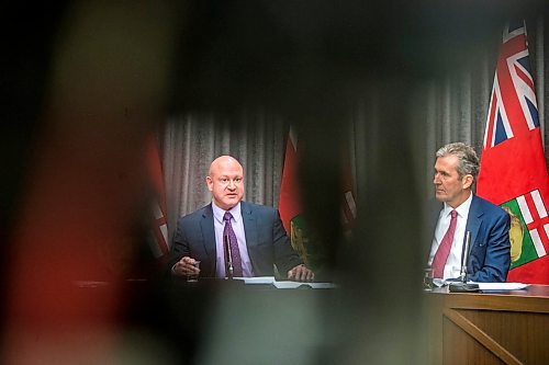 MIKAELA MACKENZIE / WINNIPEG FREE PRESS

Dr. Brent Roussin, chief provincial public health officer (left), speaks to the media about COVID-19 as premier Brian Pallister watches at the Manitoba Legislative Building in Winnipeg on Tuesday, March 17, 2020.
Winnipeg Free Press 2020